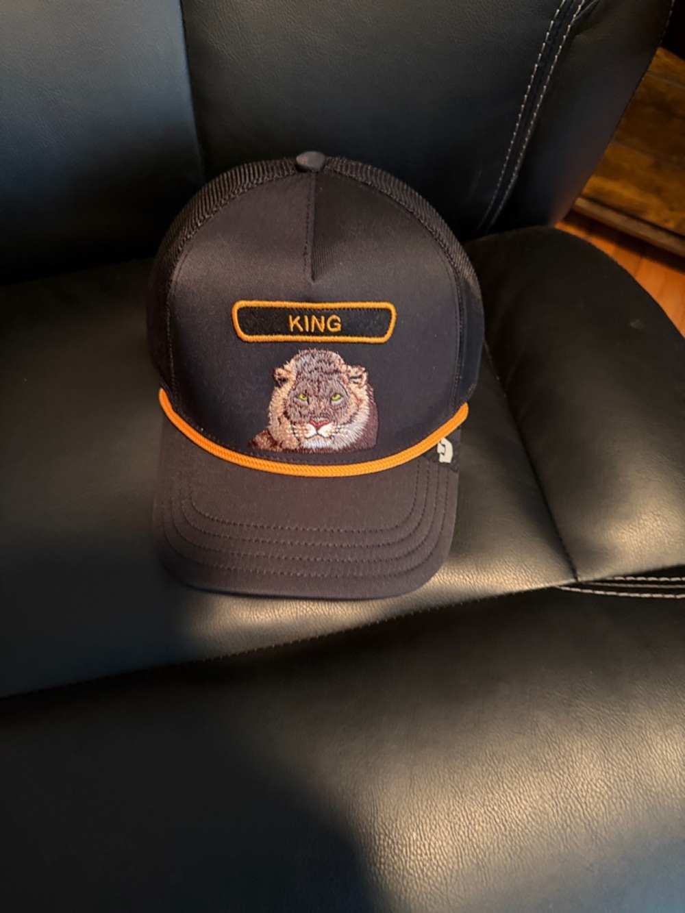 King Embroidered Lion Trucker Hat - Black with Orange Trim